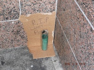 A Single Candle And A Cardboard Sign Indicate That Seven Years Ago The N.Y.C.H.A. Killed Another Kid By Actively Promoting Drugs Here!!
